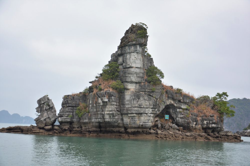 Limestone Tower In Halong Bay, Vietnam Rising From Sea
