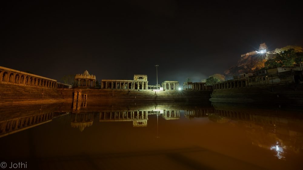 Temple Tank With Yoga Narasimha Swamy Temple In The Background